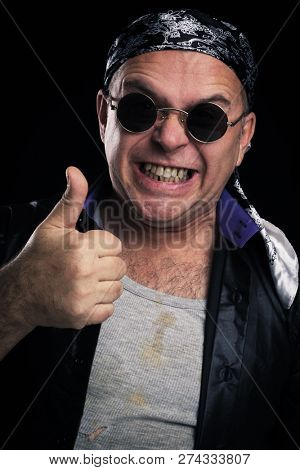Rock star making facial expression and hand gesture