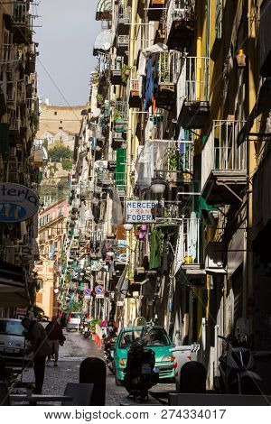 Naples, Italy - December 3, 2017: Narrow street view in Naples old town, italy.
