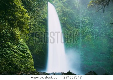 Nung Nung Waterfall With A Powerful Flow And River In Bali, Indonesia