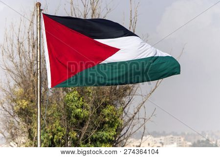 Palestine Flag On The Top Of Building In Palestine,