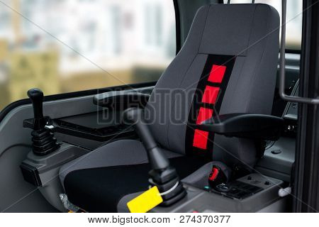 Workplace In The Cabin Of The Front Loader. Construction And Handling Equipment. Heavy Diesel Tracto