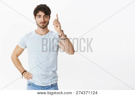 Guy Finally Mady Decision Raising Index Finger In Eureka Gesture With Joyful Smirk Feeling Ready Ord