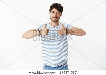 Guy Cheering Up Friend, Giving Positive Feedback Assuring Play Was Great Showing Thumbs Up And Smili