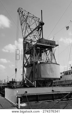 Old Crane On A Floating Pontoon, Germany.