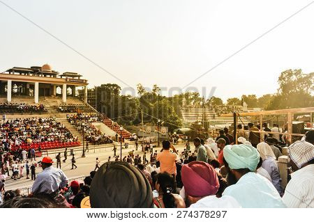 Wagha Border, Amritsar, Punjab, India - June, 2017. People Watching The Lowering Of Flags Ceremony. 