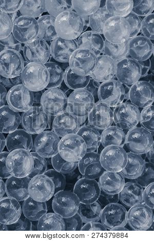 Water Grey Gel Balls With Bokeh. Polymer Gel. Silica Gel. Balls Of Grey Hydrogel. Crystal Liquid Bal
