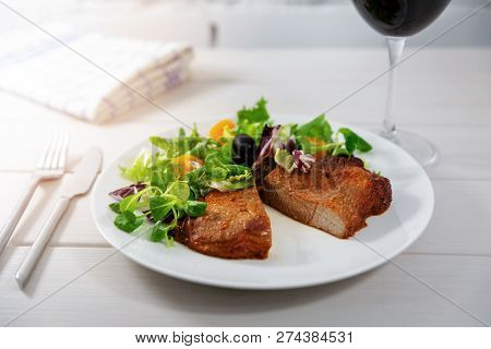 Boston Butt Meal With Fresh Salad And Wine