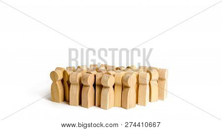 A Crowd Of People On A White Background. Many Wooden Figures Of People. The Concept Of Gregarious Fe