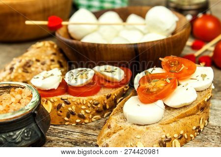 Traditional Italian Mozzarella Cheese On A Wooden Board. Healthy Cheese. Dairy Products. Mozzarella 