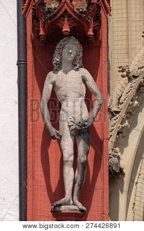 WURZBURG, GERMANY - JULY O4, 2018: Statue of Adam on the portal of the Marienkapelle in Wurzburg, Bavaria, Germany