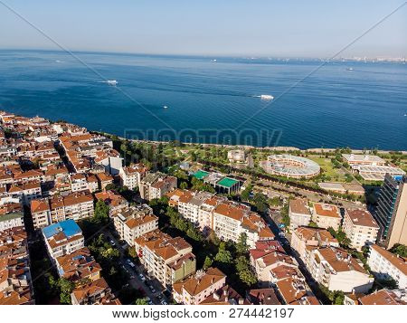 Aerial Drone View Of Unplanned Urbanization Istanbul Kadikoy Moda Seaside. Cityscape