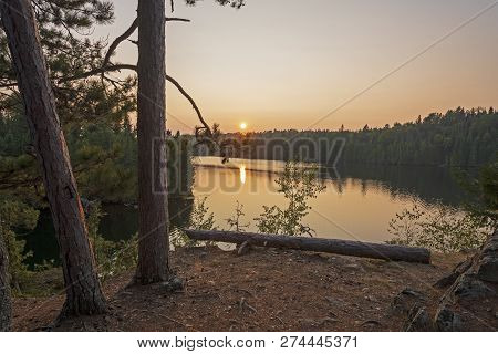 The Sun Setting On The North Woods On Other Man Lake In Quetico Provincial Park In Ontario