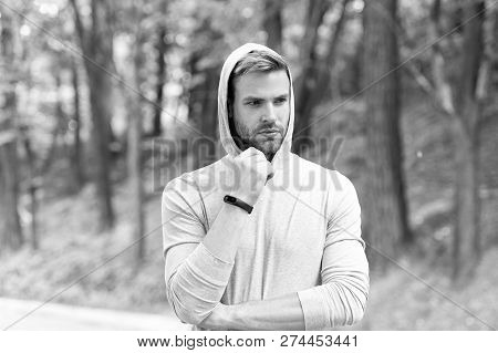 Sportsman Training With Pedometer Gadget. Fitness Tracker Concept. Man Athlete On Pensive Face With 