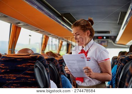 Marmaris, Turkey - May 26, 2018: Female Guide In The Bus With Tourists. People During Travel. Transf