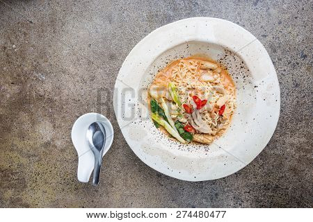 Japanese Ramen Noodle With Chicken, Shiitake Mushroms And Egg In White Bowl, Top View