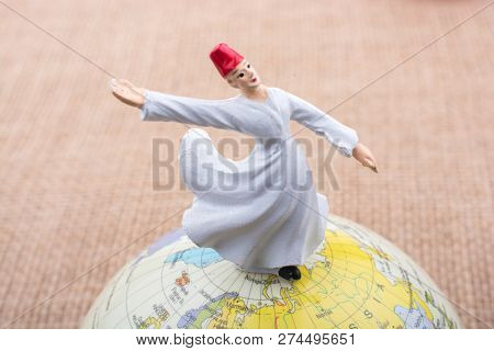 Swirling Dervish On A Globe On A Textured Background