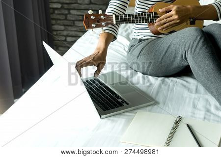 Young Woman Write A Song Or Music