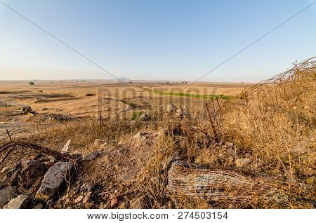 Countryside At The Israeli And Syrian Border With Remaining Barbed Wire From Fortifications At Tel S