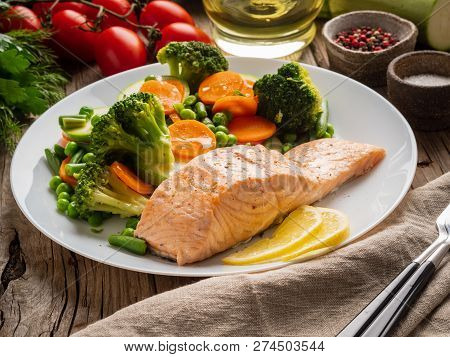 Steam Salmon And Vegetables, Paleo, Keto, Fodmap Diet. White Plate On Old Rustic Wooden Table, Side 