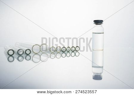 Group Of Vials With Medication On Blue Methacrylate Table. Horizontal Composition.