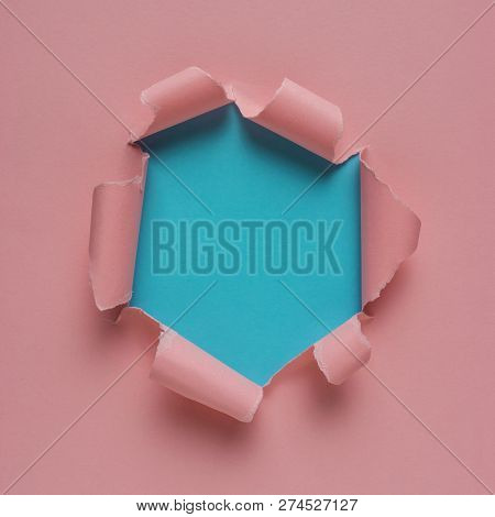 Vivid Pink Torn Paper With Burst Hole Background. Minimal Abstra