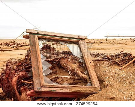Window Of A House Thrown Out On The Beach.