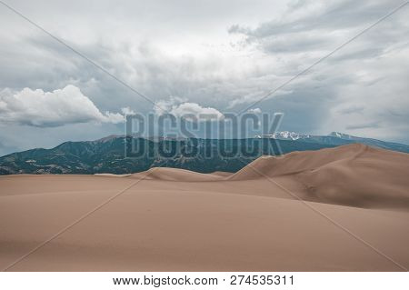 A Thunderstorm Rolling In Over The Giant Desert Sand Dunes Of Great Sand Dunes National Park In Colo
