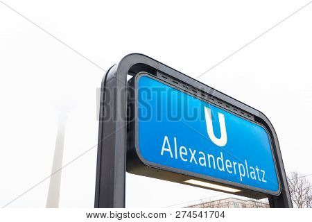Berlin, Germany - December 21, 2017. Alexanderplatz Subway Station Sign In Winter In A Foggy Day