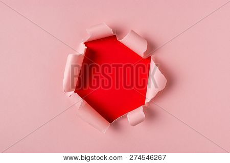 Vivid Pink Torn Paper With Burst Hole Background. Minimal Abstra