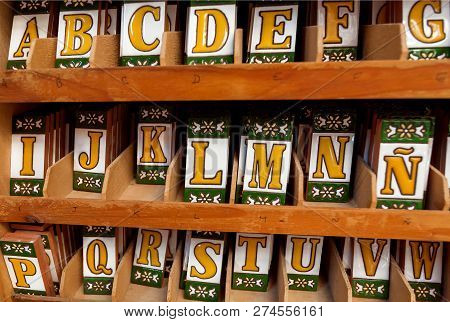 Seville, Spain - Nov 16: Colorful Ceramic Symbols Of Spanish Alphabet Inside Souvenir Shop Of Andalu