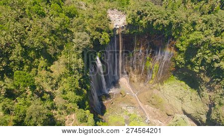 Beautiful Waterfall Coban Sewu In Tropical Forest, Java Indonesia. Aerial View Tumpak Sewu Waterfall