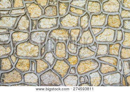Natural Stones For Cladding Construction. Texture Facing Surface Of Natural Stone With Gray Seams.