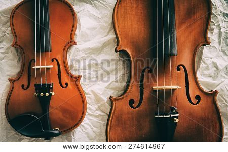 The Abstract Artdesign Background Of Two Violins,show Different Size And Detall.