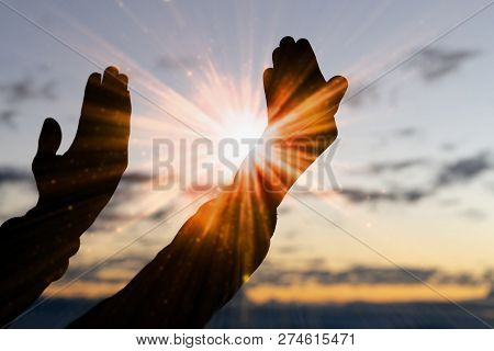 Silhouette Of Christian Man Hand Praying,spirituality And Religion,man Praying To God. Christianity 