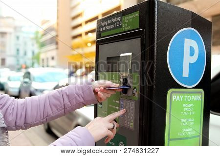 Woman Is Paying His Parking Using Credit Card At  Parking Pay Station Terminal