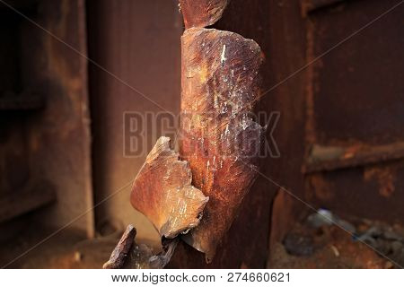 The Brown Rusted Pieces Of Torn Metal.