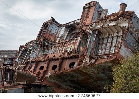 Huge Rusty Pieces Of Decommissioned Marine Ship That Was Cut And Left On The Shore.