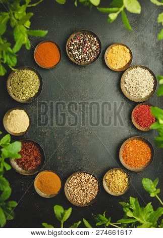 Various Bowls Of Spices Over Dark Background