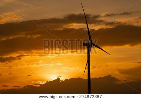 Wind Turbines Farm And Agricultural Fields On Blue Sky. Turbine Green Energy Electricity Or Wind Tur