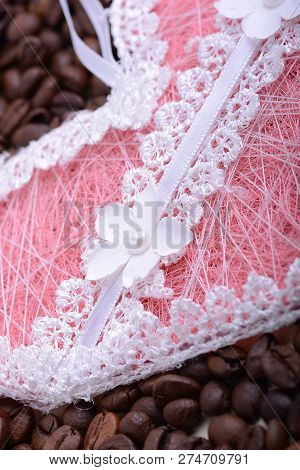 Coffee Beans Background And Papper Pink Heart. Close Up