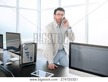 background image of a businessman in a modern office.