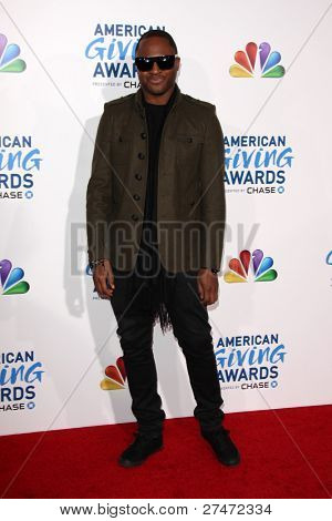 LOS ANGELES - 9 DEC: Taio Cruz anländer på 2011 amerikansk ger Awards på Dorothy Chandler Pavil