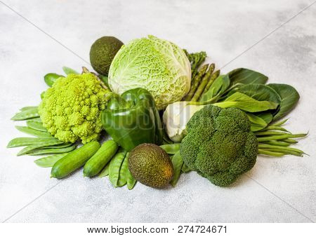 Assorted Green Toned Raw Organic Vegetables On White Background. Avocado, Cabbage, Broccoli, Caulifl
