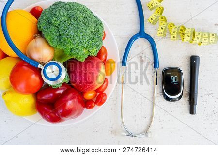 Raw Vegetables And Fruits With Blood Glucose Meter And Stethoscope, Diabetes Healthy Diet Concept