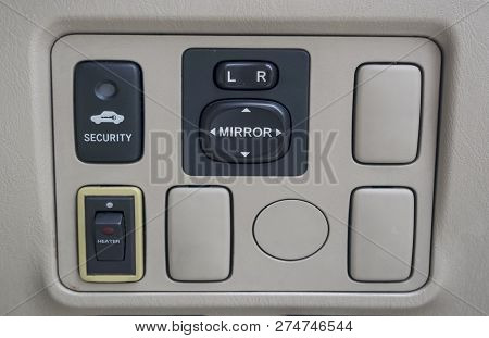 A Mirror Adjuster Panel On Car Console