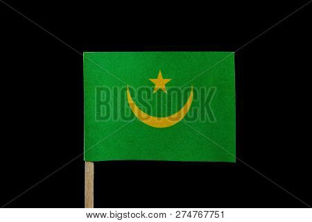A Official Flag Of Mauritania On Toothpick On Black Background. Consists Of A Green Field With A Gol