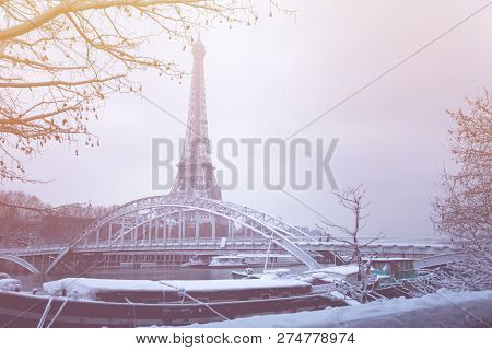 Debilly Footbridge And The Eiffel Tower In Snow