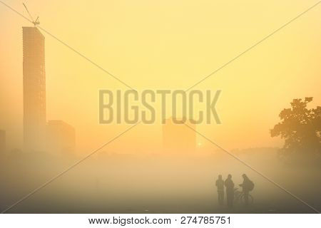 Beautiful Image Of Sunrise At Kolkata Maidan In A Foggy Winter Morning. Sunrises At The Horizon Abov