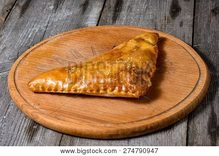 Traditional Georgian Bread - Khachapuri And Kolkh Khachapuri On The Wooden Background.