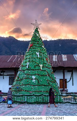 San Juan La Laguna, Lake Atitlan, Guatemala - December 16, 2018: Local Maya Tzutujil Women Walk Past